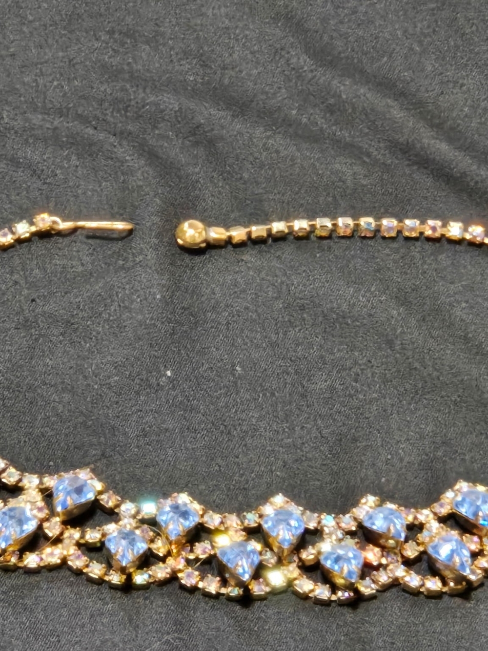 Vtg. iridescent rhinestones, blue stones, gold metal lattice necklace.